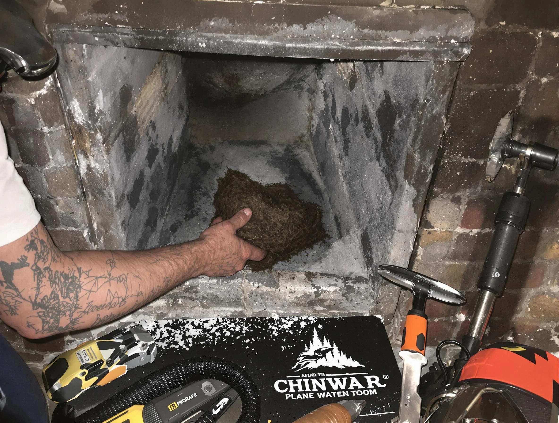 Bayonne Chimney Sweep safely removing debris and screening chimney in Bayonne, NJ